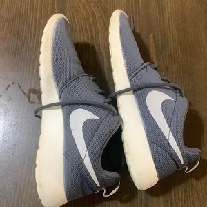 Grey and white Nike sneakers 8